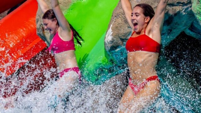 girls-jumping-into-water-980×417